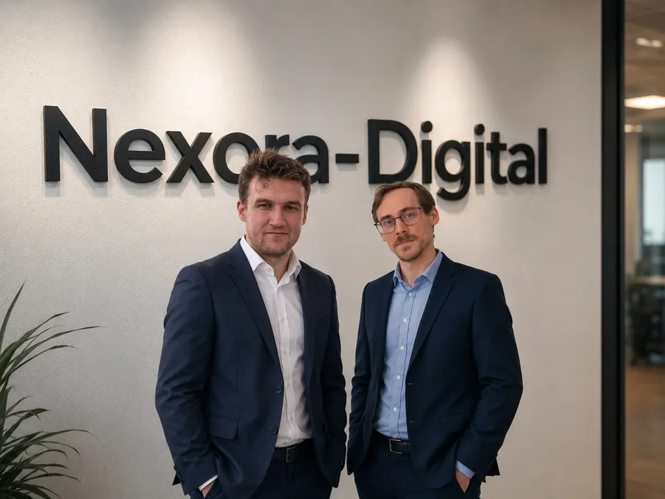 Roman Burch and Dominic Betz in front of the Nexora Digital sign